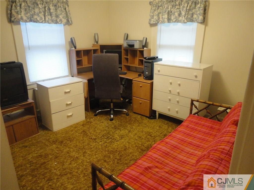 106 Walker Road West Orange, NJ 07052 - Photo 17 of 25 a bed room with a bed and a television
