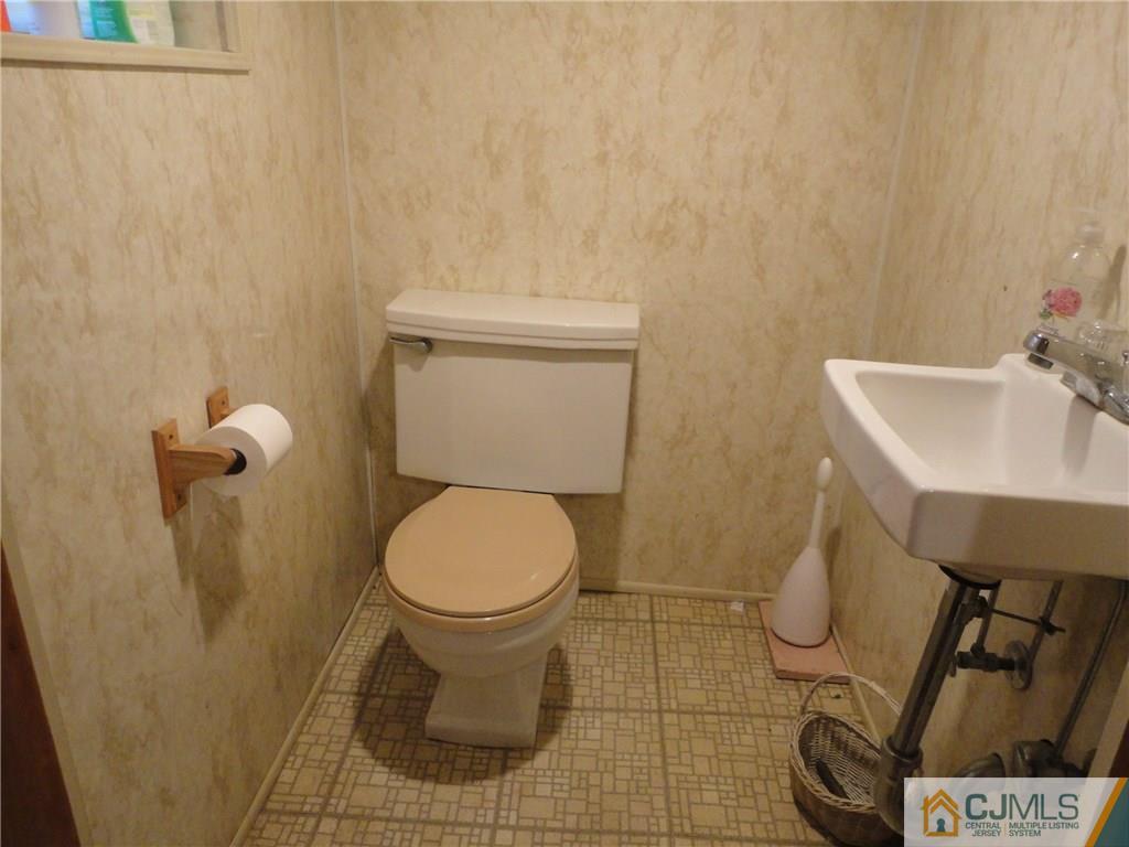 106 Walker Road West Orange, NJ 07052 - Photo 21 of 25 a bathroom with a toilet and a sink
