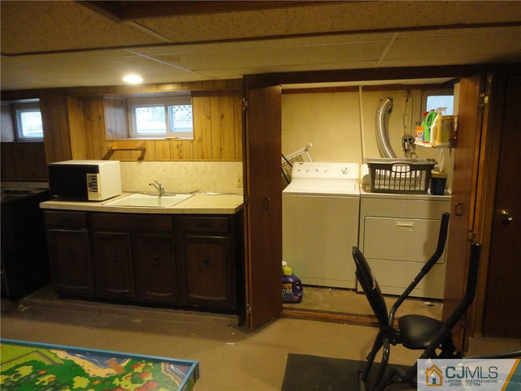 106 Walker Road West Orange, NJ 07052 - Photo 23 of 25 a bathroom with a sink and a mirror