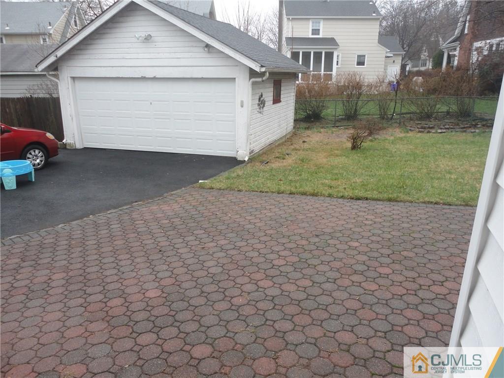 106 Walker Road West Orange, NJ 07052 - Photo 25 of 25 a front view of a house with a yard and garage