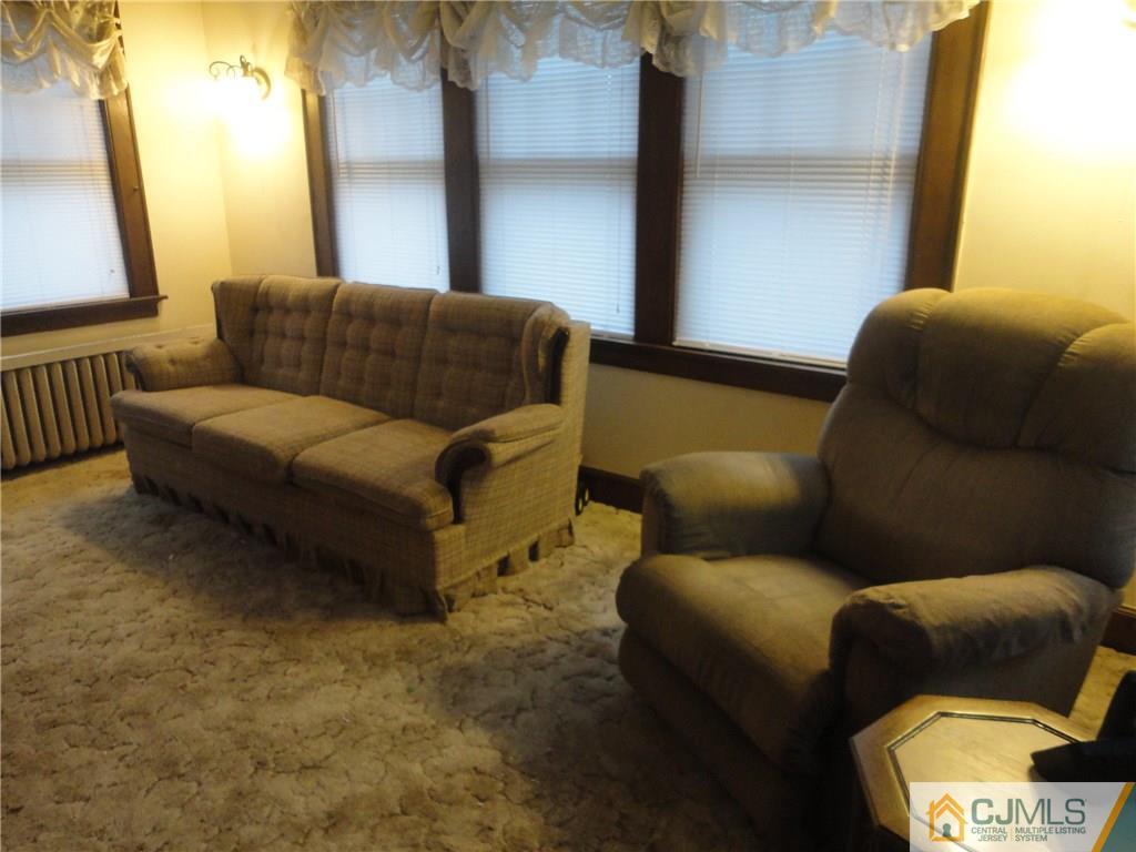 106 Walker Road West Orange, NJ 07052 - Photo 8 of 25 a living room with furniture and a window