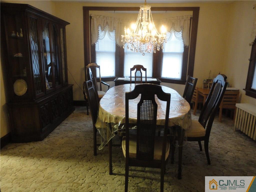 106 Walker Road West Orange, NJ 07052 - Photo 9 of 25 a view of a dining room with furniture and chandelier kitchen