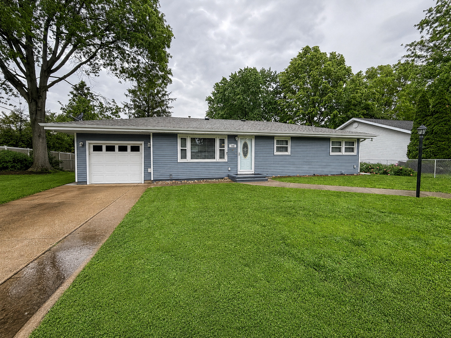 500 East Locust Street Tolono, IL 61880 - Photo 1 of 1 a front view of house with yard and green space