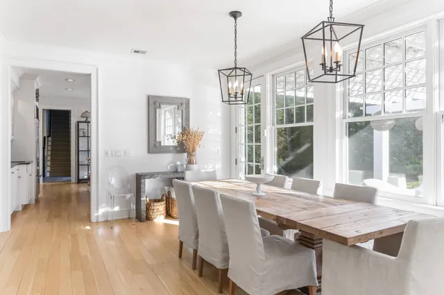 a hallway with a couch and a fireplace