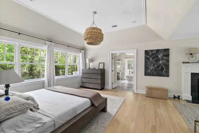 a spacious bathroom with a granite countertop sink mirror and shower