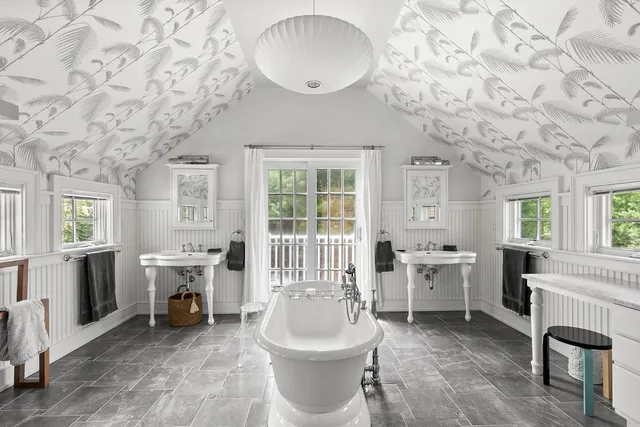 a bedroom with a bed and a chair