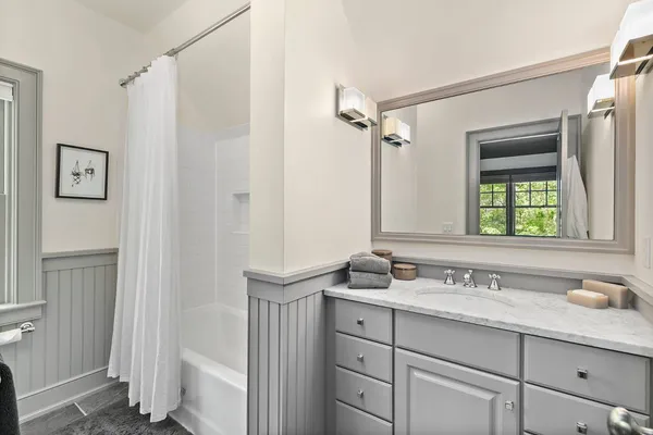 a bedroom with bed window and couch