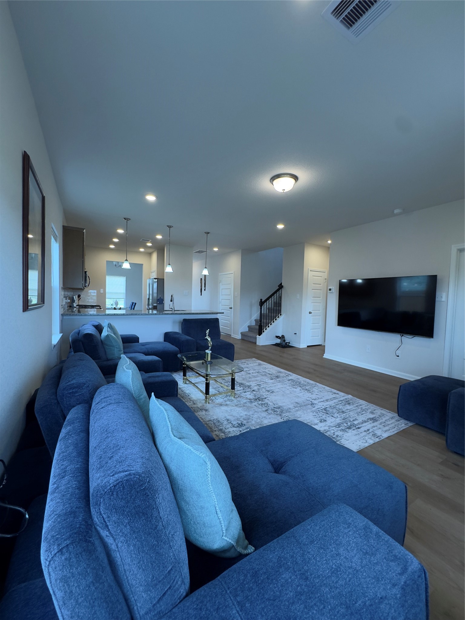 32210 Slender Spreadwing Drive Fulshear, TX 77441 - Photo 5 of 23 a living room with furniture and a flat screen tv