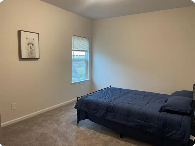 a living room with a bed