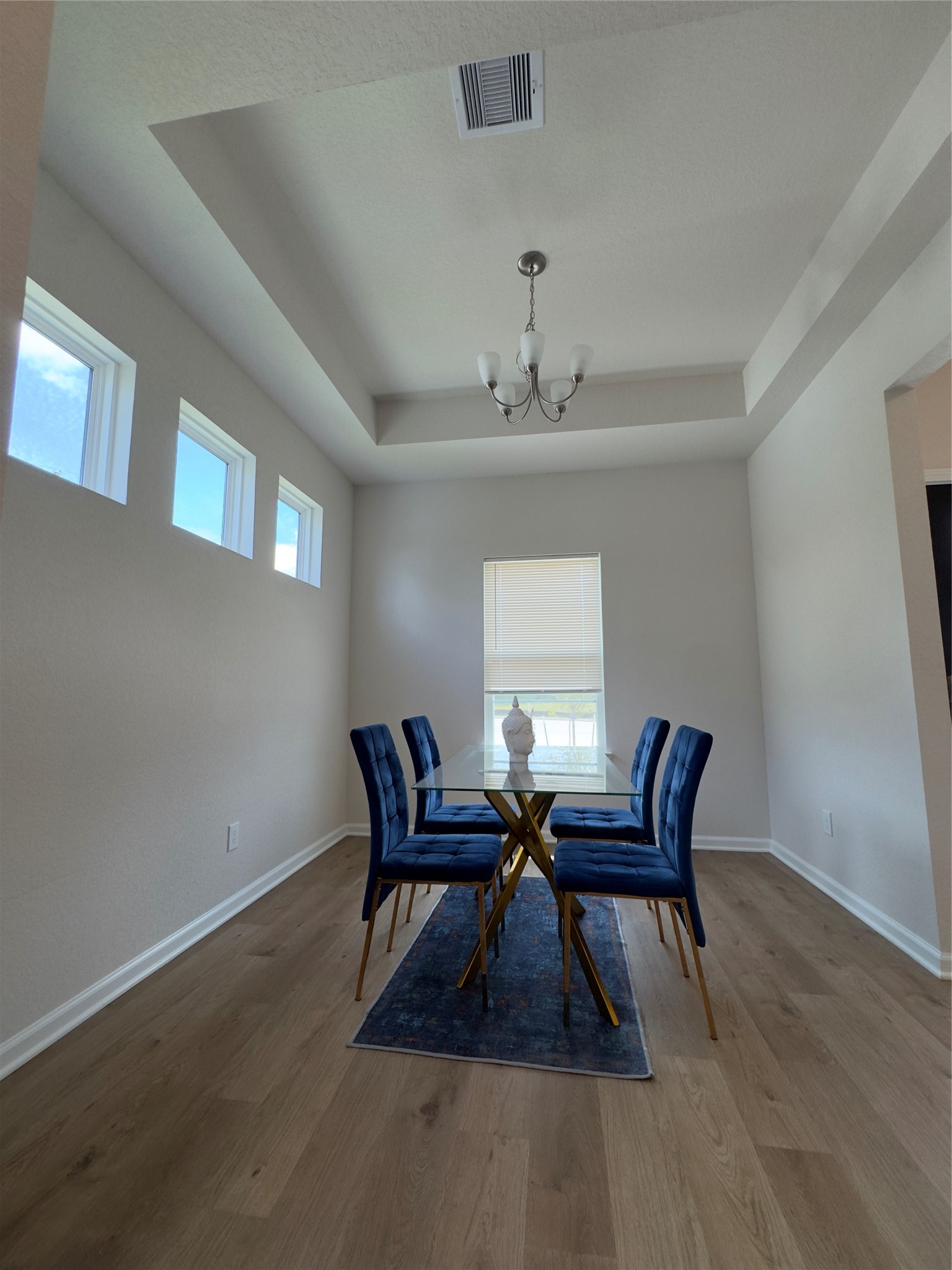 32210 Slender Spreadwing Drive Fulshear, TX 77441 - Photo 10 of 23 a view of a dining room with furniture and chandelier