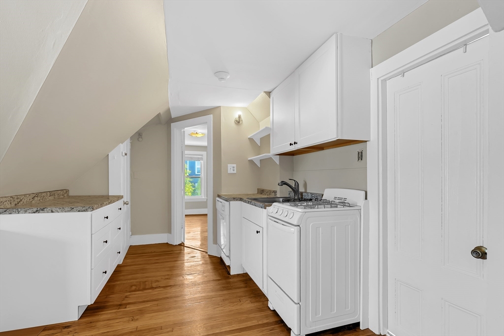 28 Evergreen Street, Unit 3 Boston, MA 02130 - Photo 1 of 16 a kitchen with stainless steel appliances a stove and more cabinets