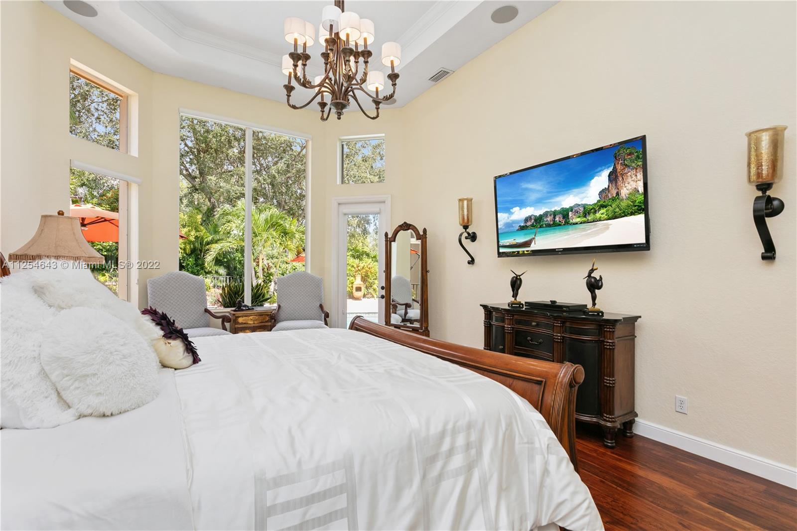 6563 Northwest 127th Terrace Parkland, FL 33076 - Photo 11 of 97 a bedroom with a bed and a flat screen tv