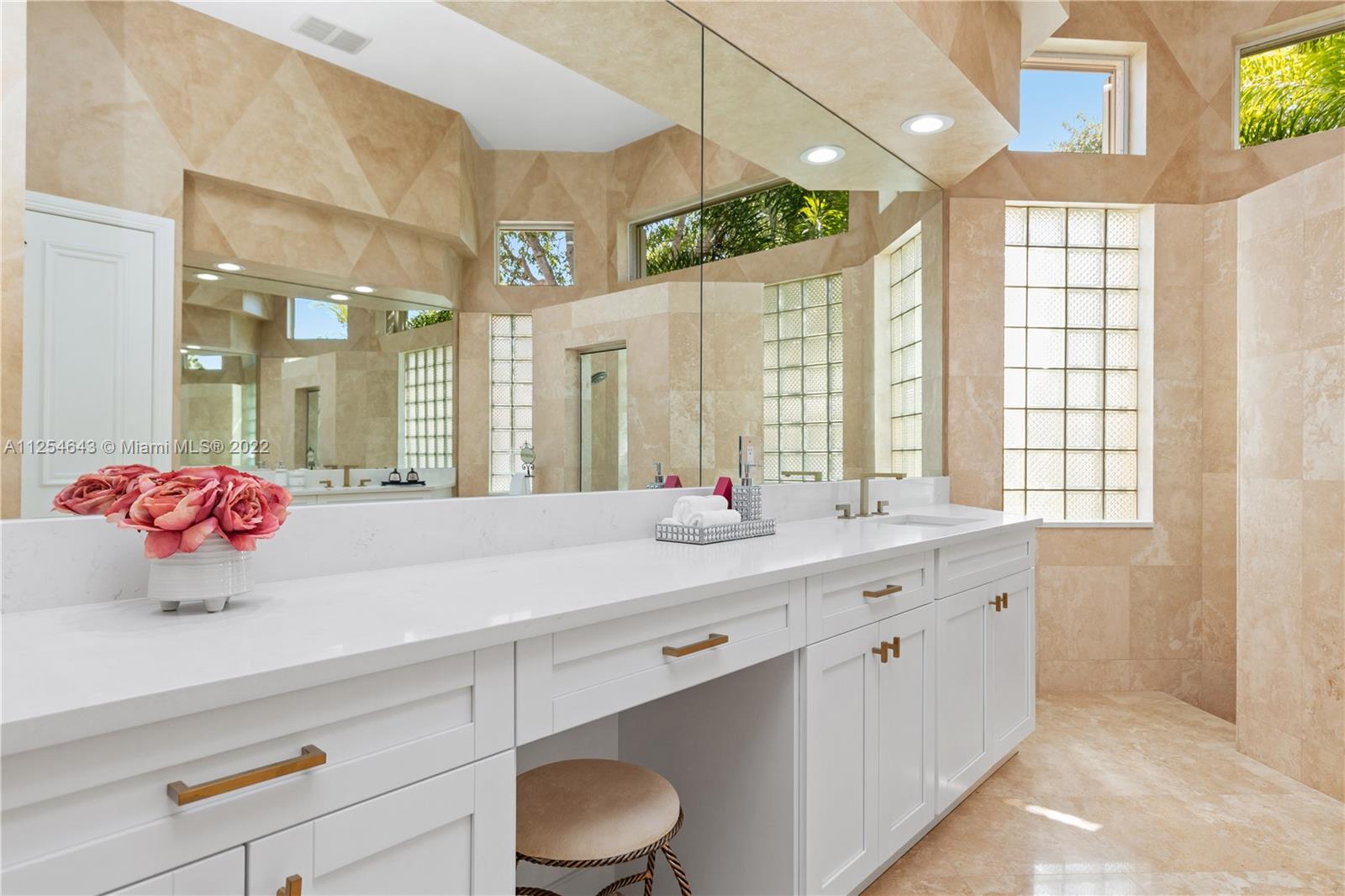 6563 Northwest 127th Terrace Parkland, FL 33076 - Photo 13 of 97 a bathroom with a granite countertop sink mirror and a shower