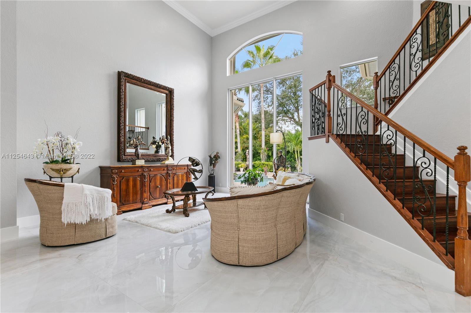6563 Northwest 127th Terrace Parkland, FL 33076 - Photo 21 of 97 a living room with furniture and a potted plant
