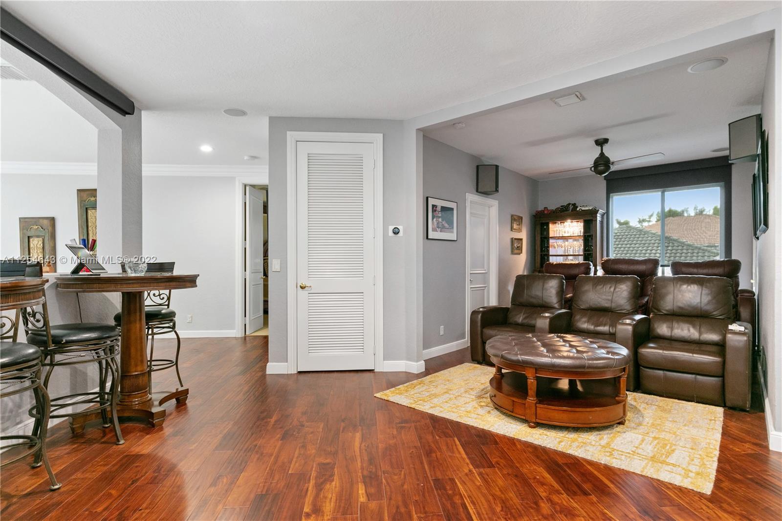 6563 Northwest 127th Terrace Parkland, FL 33076 - Photo 42 of 97 a living room with furniture and a wooden floor