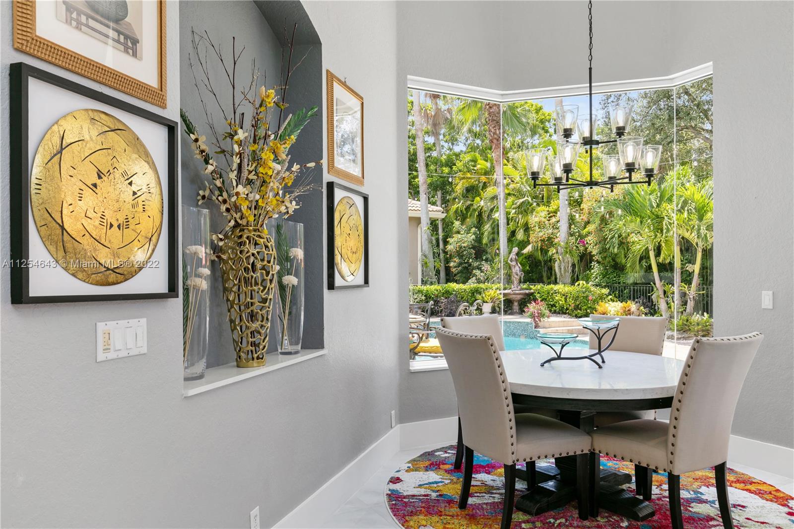6563 Northwest 127th Terrace Parkland, FL 33076 - Photo 54 of 97 a view of a dining room with furniture window and outside view