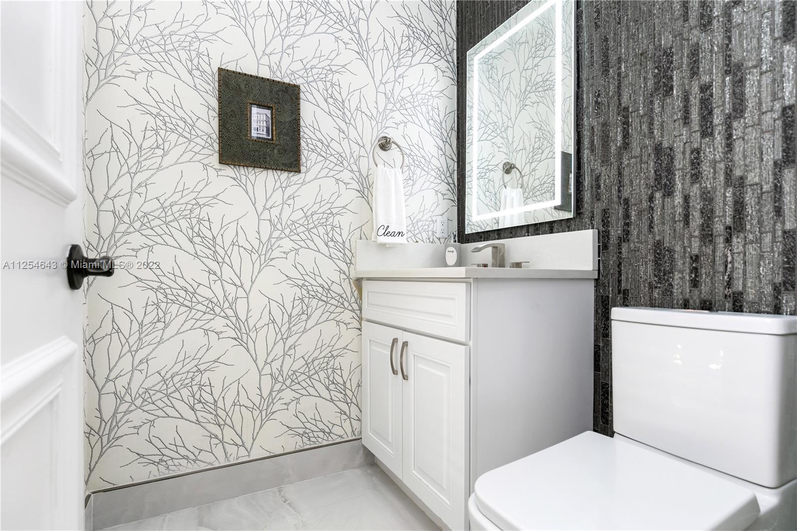 6563 Northwest 127th Terrace Parkland, FL 33076 - Photo 59 of 97 a bathroom with a sink toilet and shower