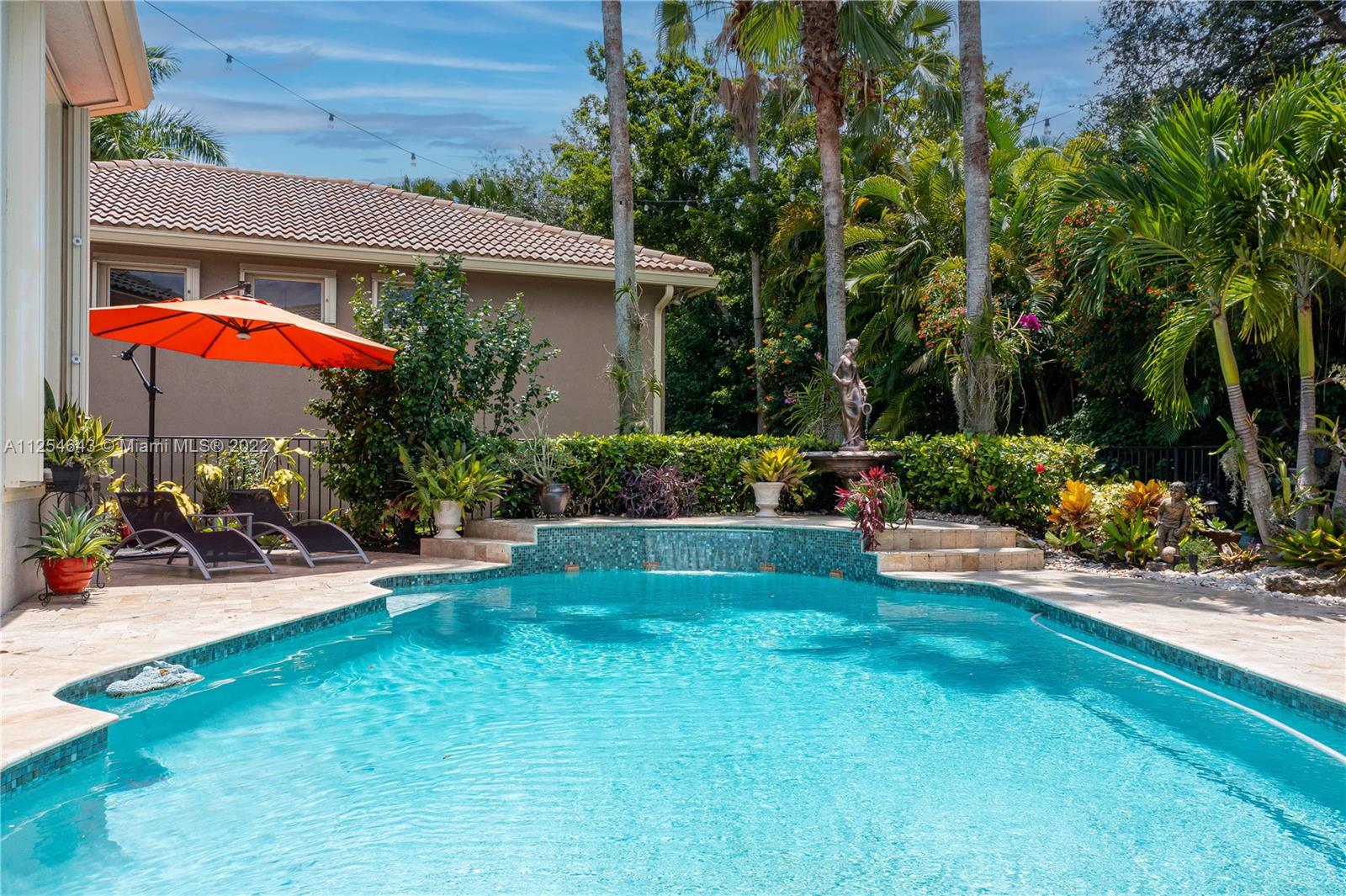 6563 Northwest 127th Terrace Parkland, FL 33076 - Photo 71 of 97 a view of a house with a yard and sitting area