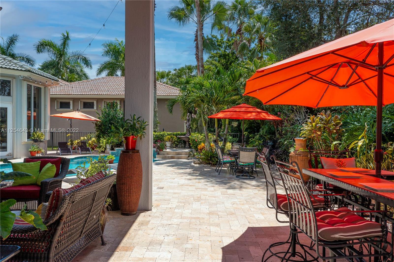 6563 Northwest 127th Terrace Parkland, FL 33076 - Photo 78 of 97 an outdoor space with seating