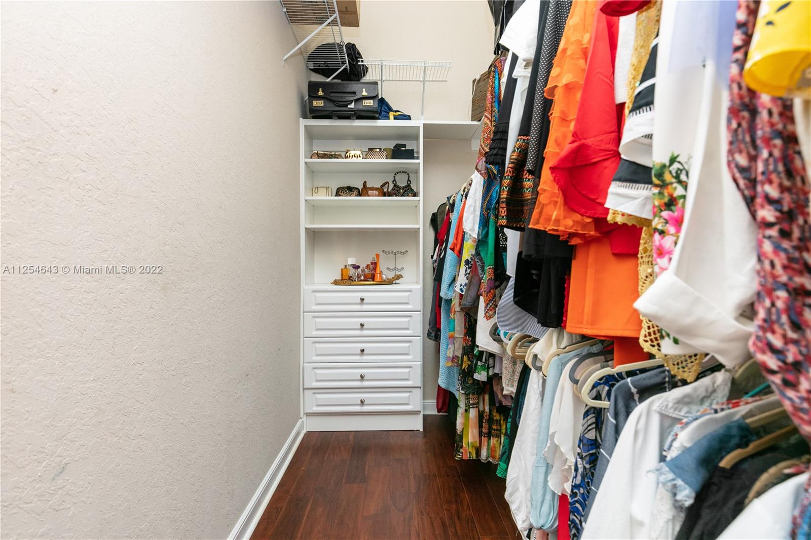 6563 Northwest 127th Terrace Parkland, FL 33076 - Photo 86 of 97 a view of walk in closet with clothes and shoes