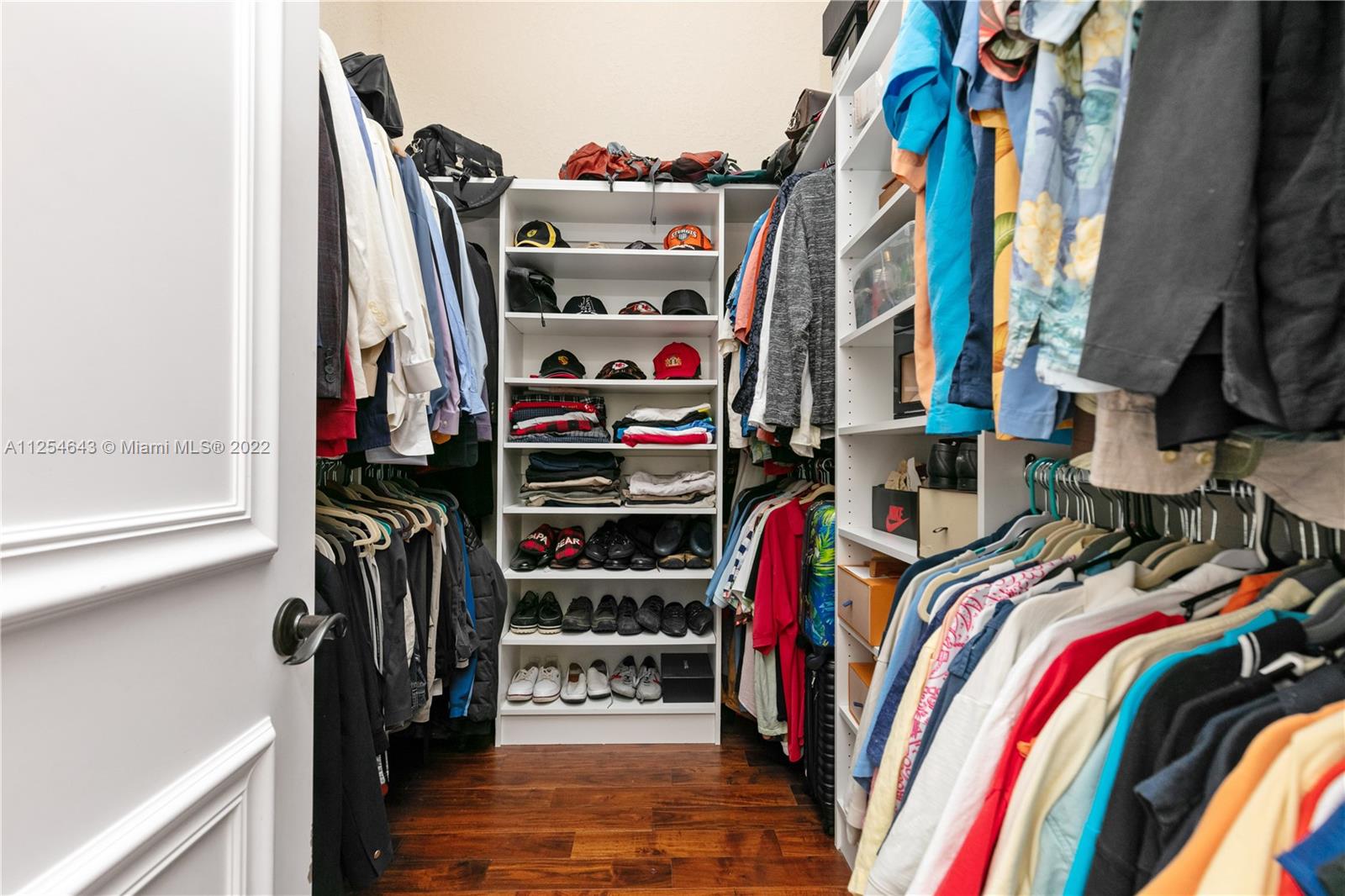 6563 Northwest 127th Terrace Parkland, FL 33076 - Photo 88 of 97 a view of walk in closet with clothes and shoes