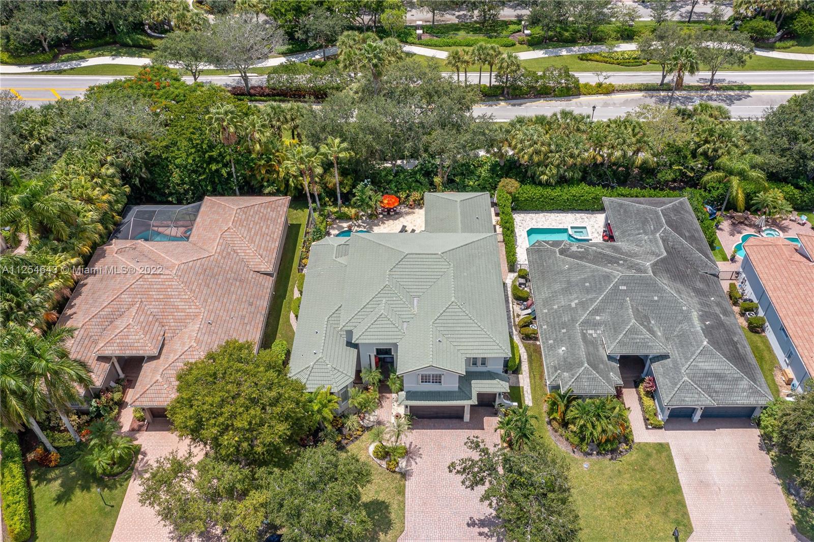 6563 Northwest 127th Terrace Parkland, FL 33076 - Photo 89 of 97 an aerial view of house with yard swimming pool and outdoor seating