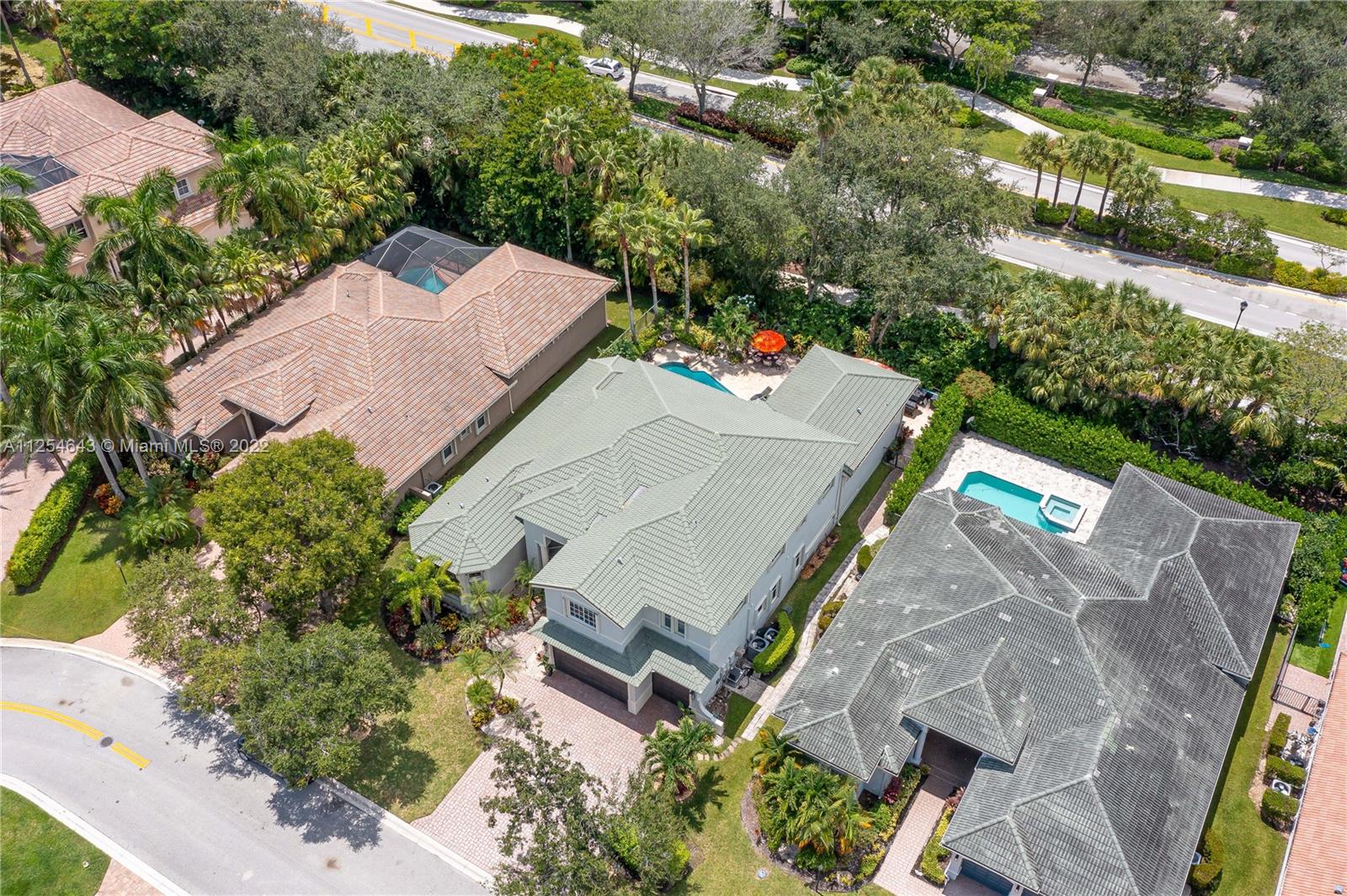 6563 Northwest 127th Terrace Parkland, FL 33076 - Photo 91 of 97 an aerial view of a house with a yard and lake view