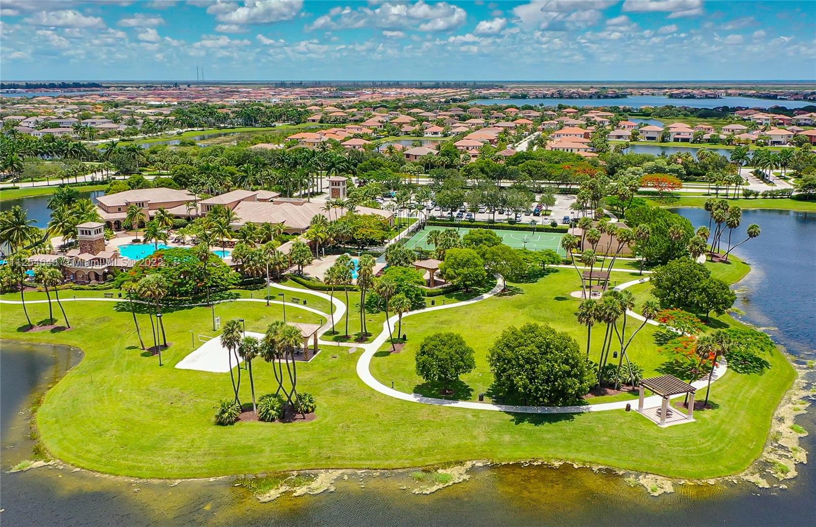 6563 Northwest 127th Terrace Parkland, FL 33076 - Photo 94 of 97 a view of a swimming pool with a yard