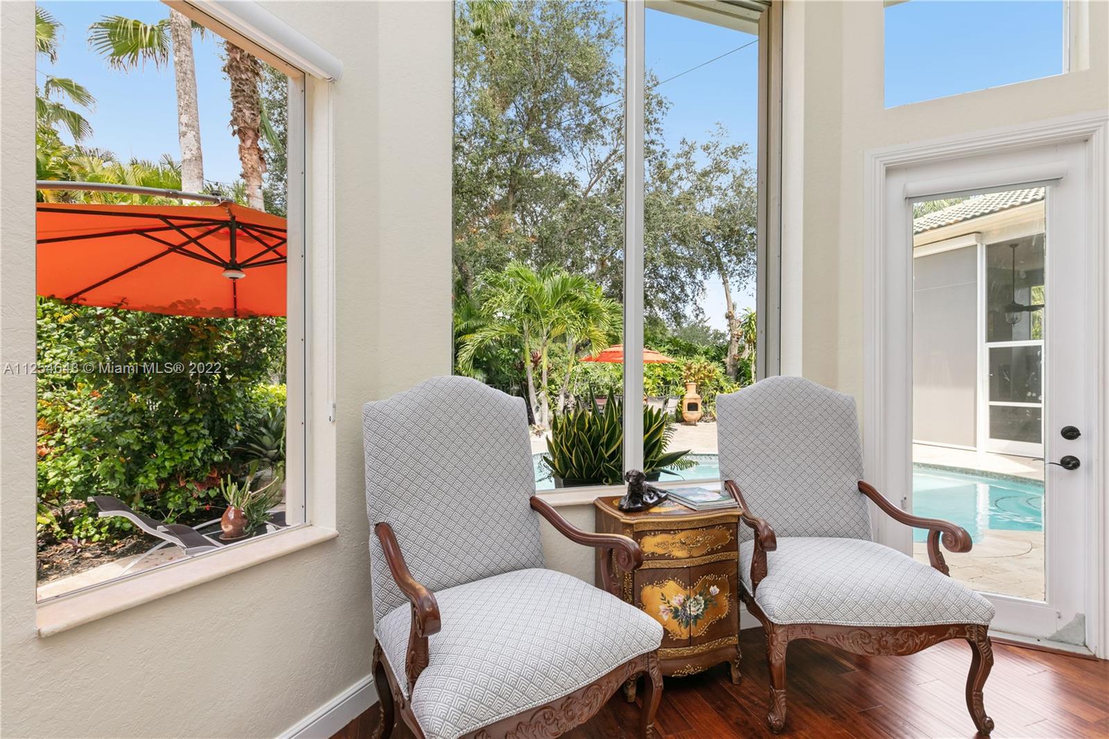 6563 Northwest 127th Terrace Parkland, FL 33076 - Photo 10 of 97 a view of a room with furniture and wooden floor