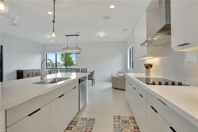a kitchen with a sink stove and cabinets