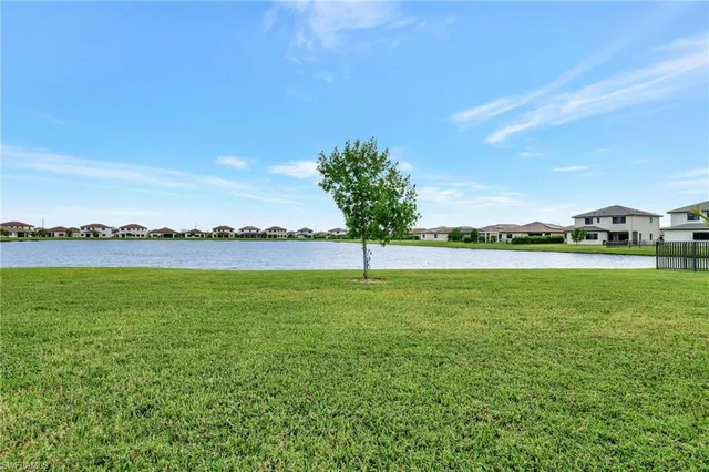 a view of a lake with a yard
