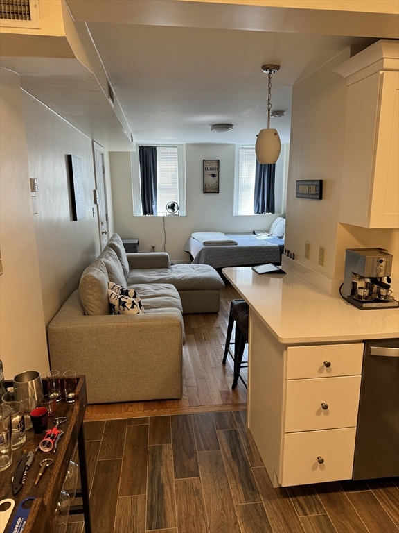 2 Sackville Street, Unit 1 Boston, MA 02129 - Photo 2 of 8 a living room with furniture and wooden floor