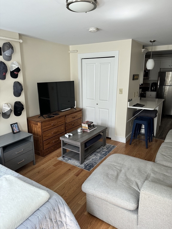 2 Sackville Street, Unit 1 Boston, MA 02129 - Photo 5 of 8 a living room with furniture and a flat screen tv