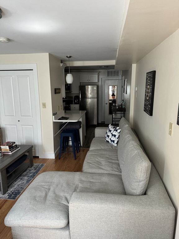 2 Sackville Street, Unit 1 Boston, MA 02129 - Photo 6 of 8 a living room with furniture and a fireplace