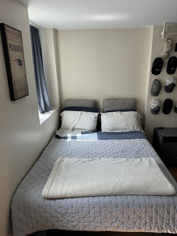 2 Sackville Street, Unit 1 Boston, MA 02129 - Photo 7 of 8 a bedroom with a bed and a window