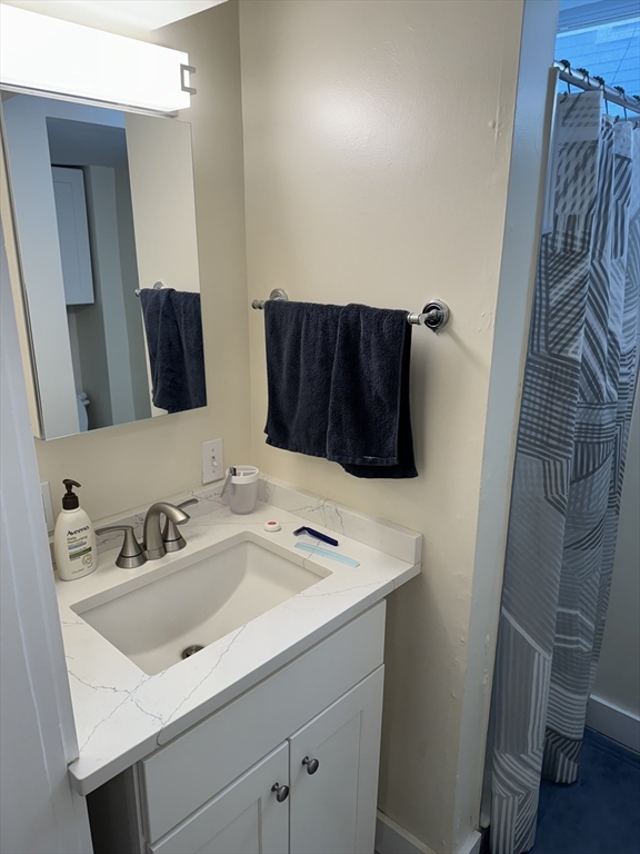 2 Sackville Street, Unit 1 Boston, MA 02129 - Photo 8 of 8 a bathroom with a sink and a mirror
