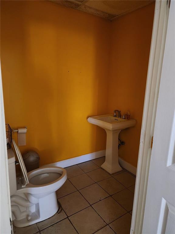 6958 Main Street Lithonia, GA 30058 - Photo 19 of 55 a bathroom with a sink and toilet
