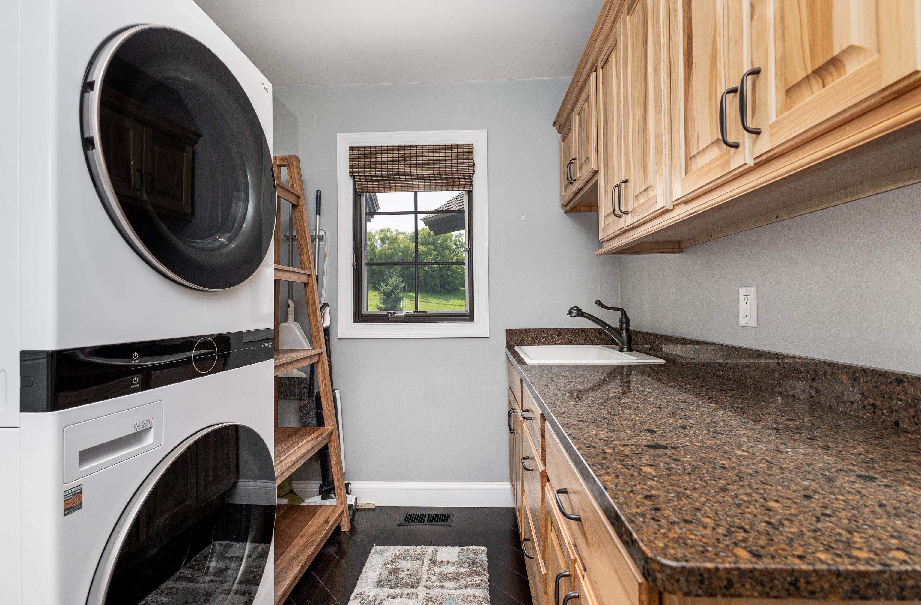 6 Hickory Trail Galena, IL 61036 - Photo 30 of 67 a kitchen with granite countertop a sink a washer and dryer