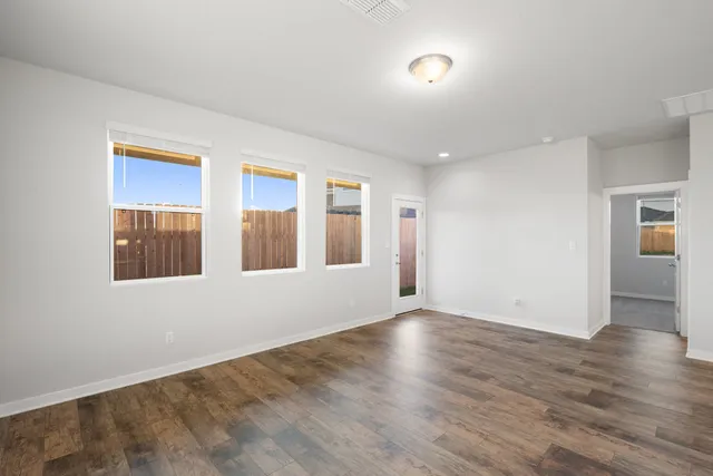 a view of kitchen with wooden floor