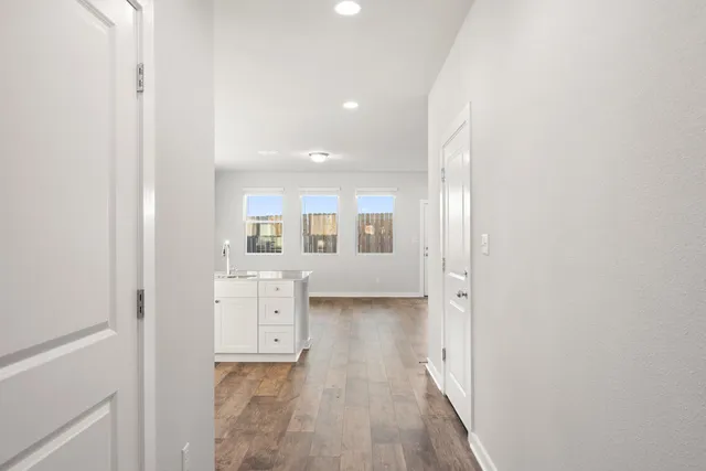 a kitchen with stainless steel appliances a refrigerator sink and microwave