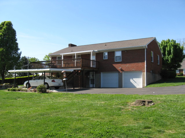 4003 Cove Road Roanoke, VA 24017 - Photo 2 of 14 a view of a house with a yard and sitting area