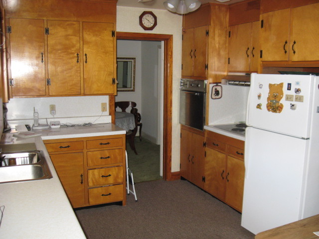 4003 Cove Road Roanoke, VA 24017 - Photo 12 of 14 a kitchen with stainless steel appliances granite countertop a refrigerator a stove and a sink with wooden floor