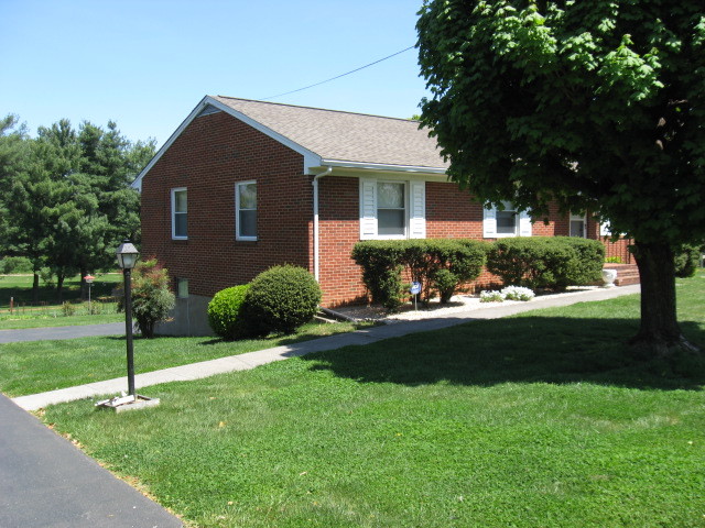 4003 Cove Road Roanoke, VA 24017 - Photo 3 of 14 a front view of a house with garden