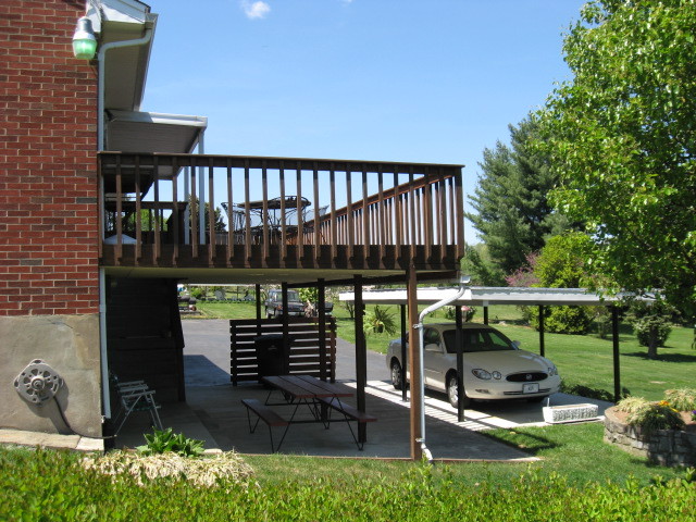 4003 Cove Road Roanoke, VA 24017 - Photo 4 of 14 a view of a patio with a table chairs and a potted plant