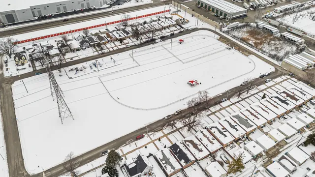 a picture of a bench in front of a building