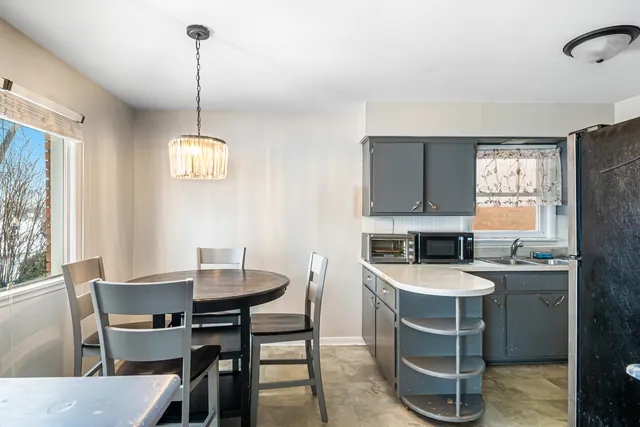 a view of a kitchen area with furniture and window