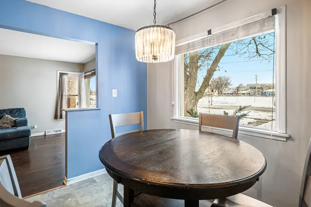 a view of a dining room with furniture window and outside view