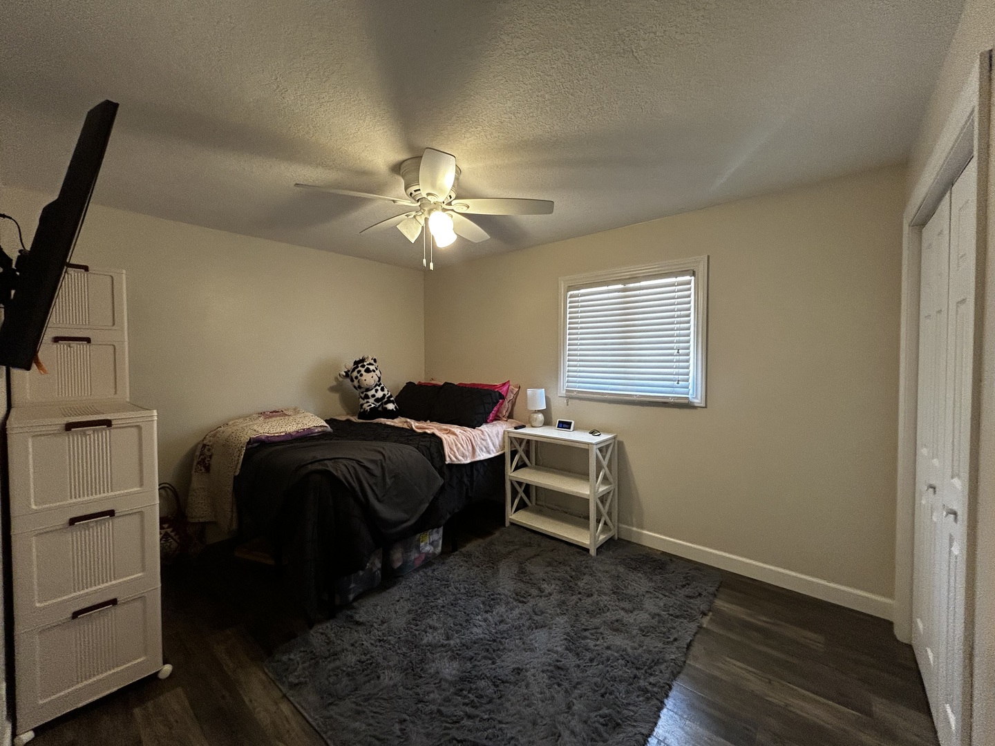12795 Lawrence Road Sterling, IL 61081 - Photo 26 of 42 a bedroom with a bed and a chandelier