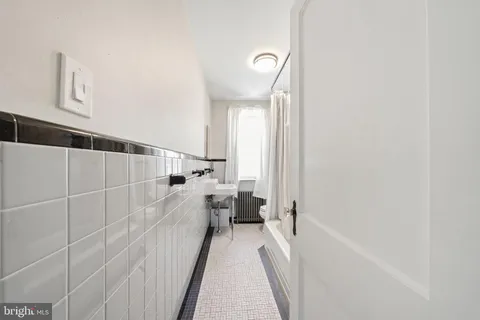 a view of a bathroom with a sink and mirror