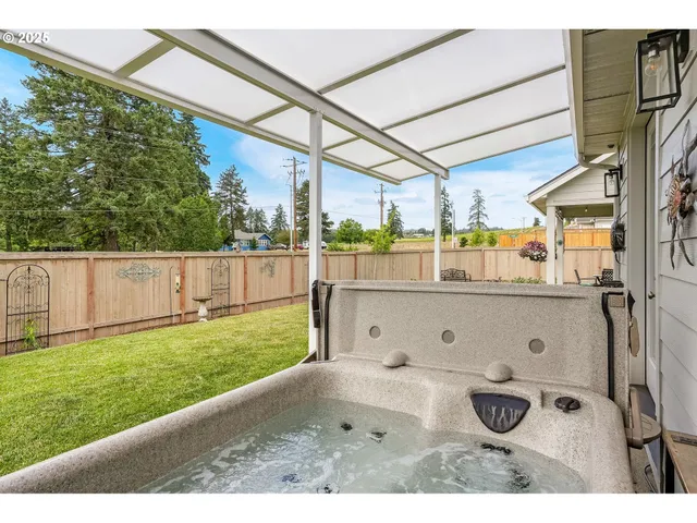 a view of a bathroom with a tub and mirror